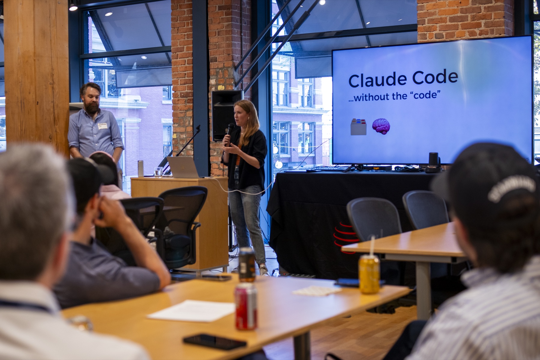 Annika Lewis and Matthew Hall teaching together at the front of a Claude for Leaders workshop